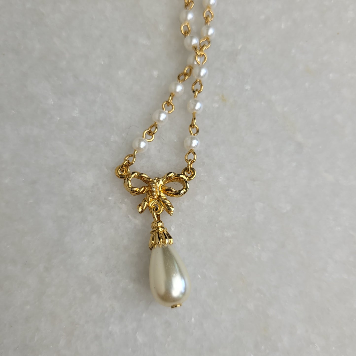 Gold Tone Faux Pearl Bow Pendant Necklace