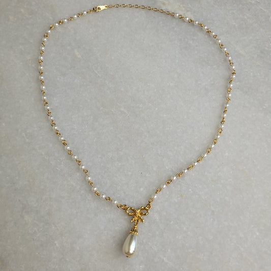 Gold Tone Faux Pearl Bow Pendant Necklace